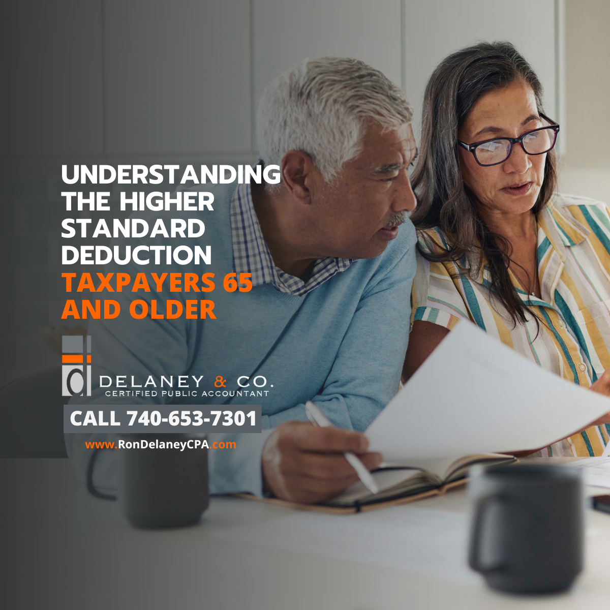 Older couple reviewing tax paperwork at a kitchen table